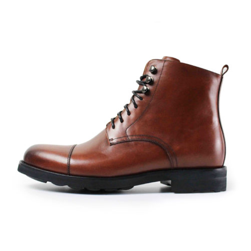 picture of brown handmade dapper leather boots from the side with a white background
