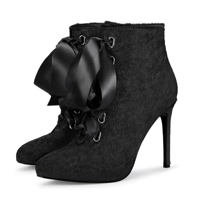 picture of the side of black ankle boots with fashion ribbon and high heel